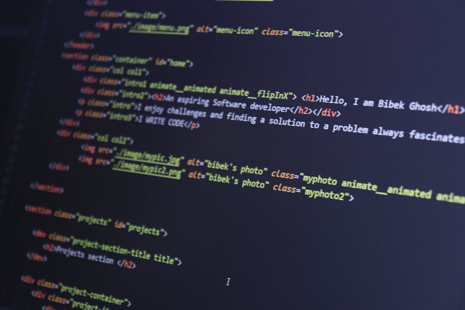 A photograph of a computer screen displaying lines of HTML code in a text editor, with syntax highlighting in various colors including blue, red, yellow, and white. The code snippet contains tags for 